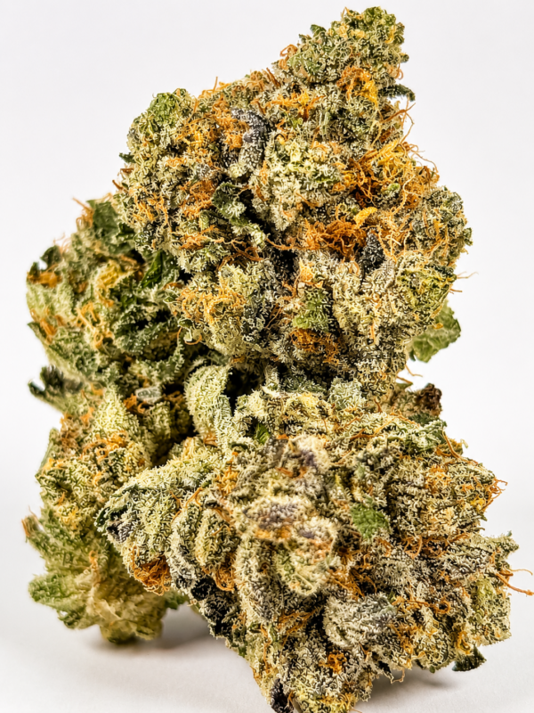 Premium Tom Ford cannabis flower with dense frosty buds, sparkling trichomes, and subtle purple hues on a white background.